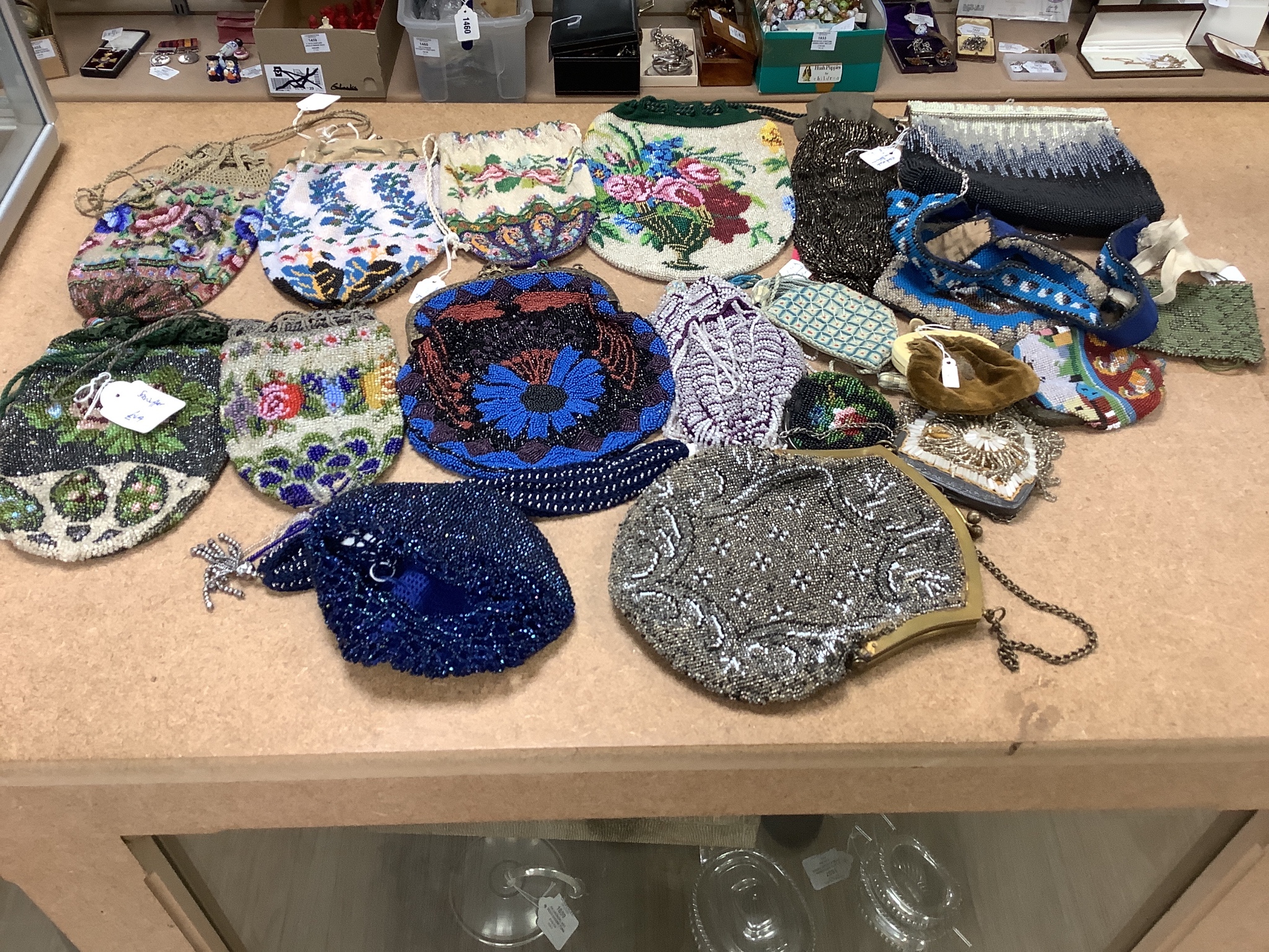 A collection of approximately fifty Victorian and later beadwork, white metal and fabric purses etc.